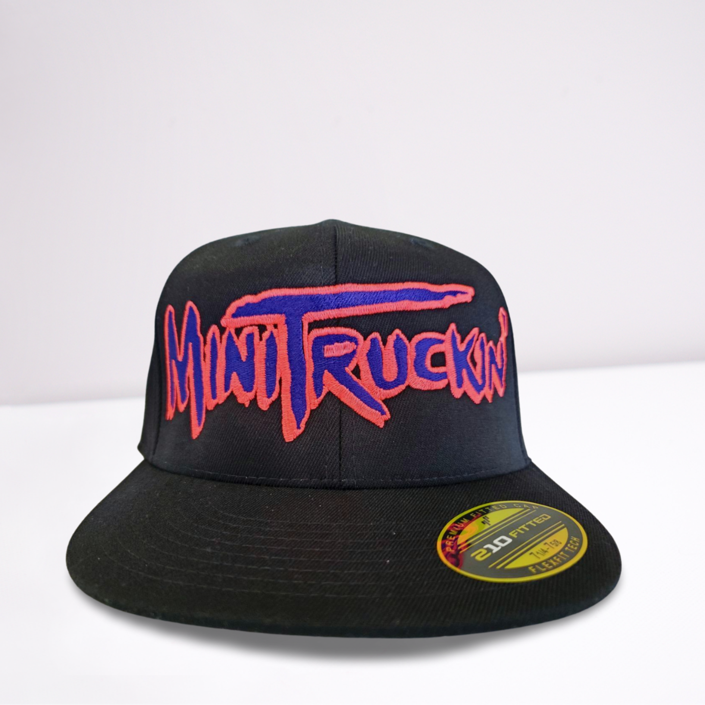 Stretch Fit Cap - Mini Truckin' - Black Hat with Large Purple and Pink Font