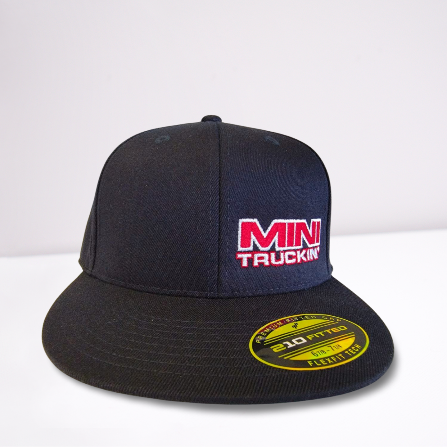 Stretch Fit Cap- Mini Truckin' - Black Hat with Red Block Font